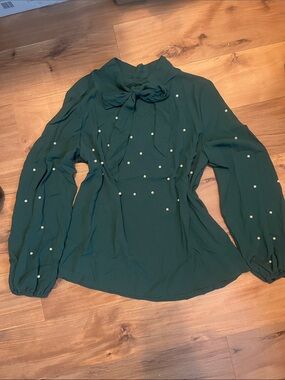 Woman’s green blouse with Pearl accents